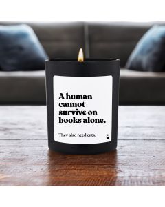 Duftkerze Schwarz Woody A human cannot survive on books alone. They also need cats.